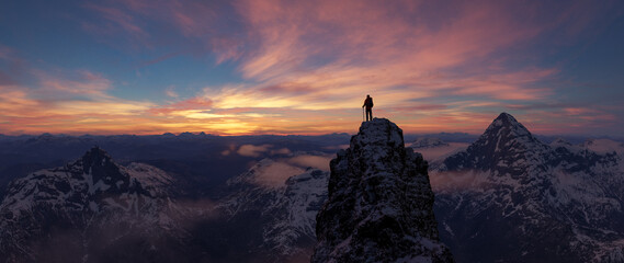 Climber Standing On Snowy Peak At Sunset Over Vast Alpine Mountain Range © edb3_16