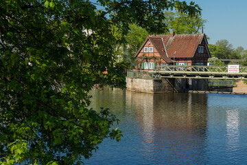 Obraz premium old half-timbered house next to the water