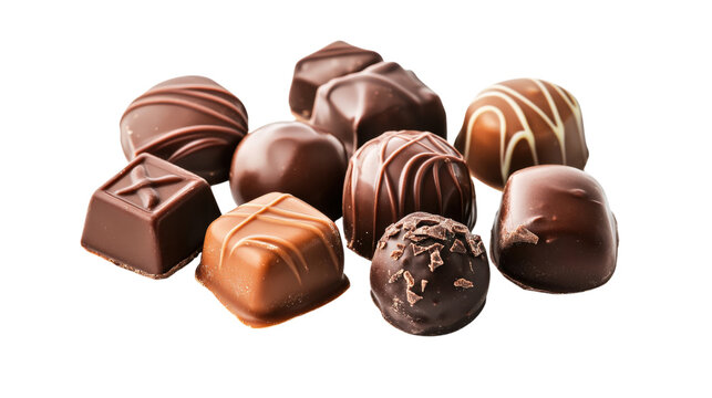 Variety of gourmet chocolate truffles and pralines on checkerboard background