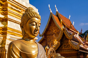 Chiang Mai, Thailand &ndash; Portrait photographs of golden Buddha statues at Wat Phra That Doi Suthep Temple, the most famous temple in Chiang Mai.