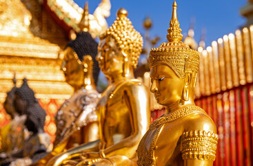 Chiang Mai, Thailand &ndash; Portrait photographs of golden Buddha statues at Wat Phra That Doi Suthep Temple, the most famous temple in Chiang Mai.