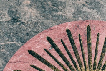 Stone texture background abstract with pink marble and gold fan pattern decoration on grey basalt surface. Elegance natural material close up.