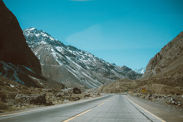 Fototapeta premium Mountain road crossing the Andes on the Chilean side under clear blue sky.