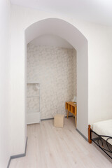 Bright bedroom alcove with arched doorway