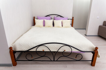 Bright modern bedroom with double bed