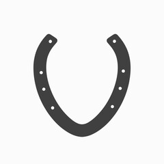 Close-Up of a Metal Horseshoe on White Background with Evenly Spaced Nail Holes Symbolizing Luck and Protection in Equine and Rustic Traditions