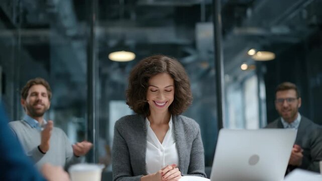 Corporate team celebrates success as woman joyfully scatters financial reports over the table in modern office setting during daytime