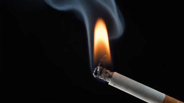 Medium Close-up of Glowing Cigarette Tip with Smoke in Darkness