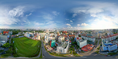 Obraz premium 360-degree aerial spherical panorama of Singapore city skyline from a city park with modern skyscrapers and urban greenery