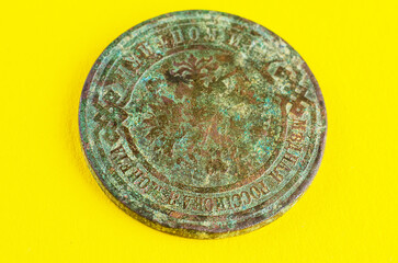 Fototapeta premium Reverse side of old imperial copper coin with worn details and natural patina