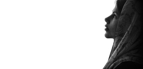 Young girl with bible praying to God