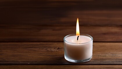 Burning Candle On A Wooden Background
