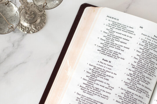 Biblical text for justice in open holy bible book. Christian concept.