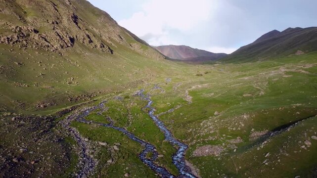 Aerial shot of mountain valley near Kol Ukok in the Tian Shan Mountains of Kyrgyzstan.