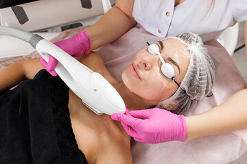 IPL intense pulsed light facial treatment in cosmetic dermatology clinic