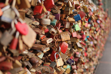 Close-up of thousands of colorful love locks attached to a bridge in Cologne, Germany.