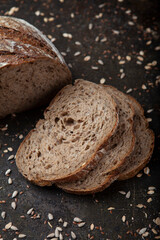 Sliced Sunflower Seed Bread Presentation. Artisan Sunflower Seed Bread on Rustic Surface. Freshly Sliced Sunflower Bread on Table. Healthy Sunflower Seed Bread Slices.