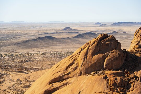 Rocky desert plain stretches to the distant horizon, Spitzkoppe, Namibia
