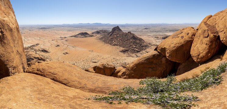 Rocks with a wide view over the dry landscape of Spitzkoppe, Spitzkoppe, Erongo, Namibia