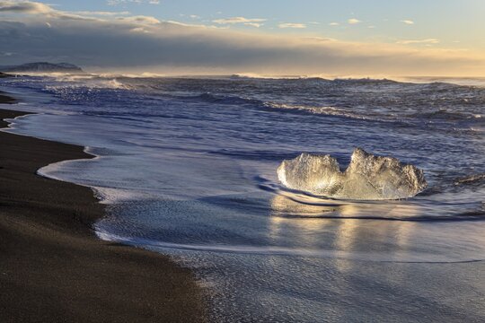 Ice floes on the beach, waves, sunny, morning mood, winter, Diamond Beach, Breidamerkursandur, J&ouml;kulsarlon, Iceland