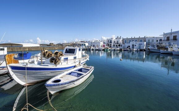 Fishing boats in Naoussa harbour, White Cycladic houses, Naoussa, Paros, Cyclades, Greece