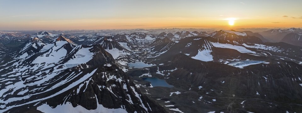 Aerial view of the peaks of Swedish Lapland, view into the valley Unna R&auml;itavagge, also Unna Reaiddavaggi, at midnight sun, mountain Pyramiden and Knivkammen, Kebnekaise massif, Lapland, Sweden
