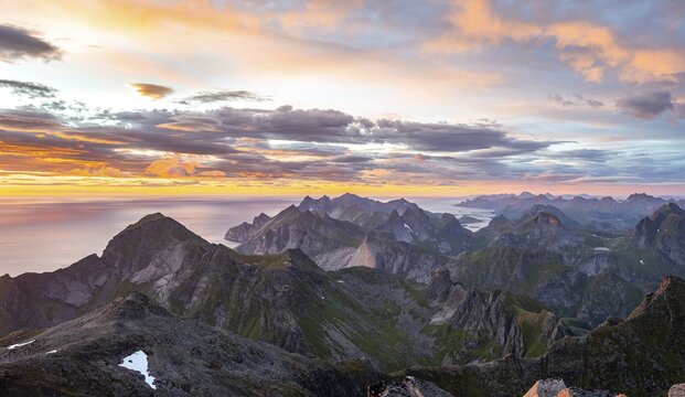 View over mountain tops and sea, dramatic sunset, from Hermannsdalstinden, Moskenes&ouml;y, Lofoten, Nordland, Norway