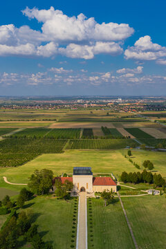 Aerial view of the Odescalchi Castle stands majestically amidst the verdant fields, a testament to timeless beauty against the vast, azure sky, Ilok, Vukovar-Srijem County, Croatia.