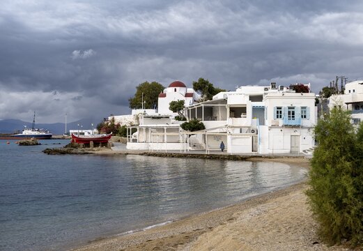 Paralia Choras Mikonou beach, white Cycladic houses of Mykonos town, Mykonos, Cyclades, Greece