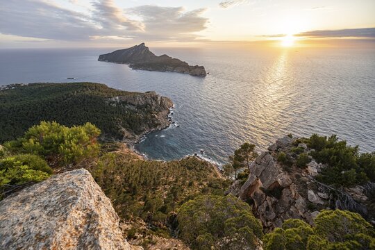 View of mountains and coast with sea, at sunset, walking to La Trapa from Sant Elm, back island of Sa Dragonera, Serra de Tramuntana, Majorca, Spain