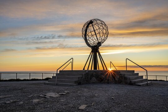 Steel globe at the North Cape under the midnight sun, Nordkapp, Finnmark, Norway