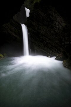 Waterfall in dark gorge, Wildhaus, Appenzell, Switzerland