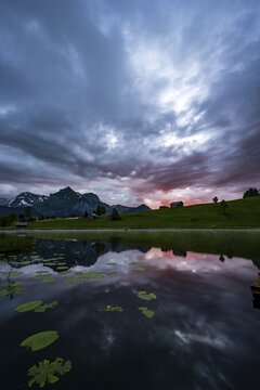 Schwendisee with reflection of the Altmann peak, Wildhaus, Appenzell, Switzerland