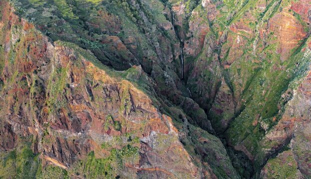 Aerial view, waterfall in a valley with cliffs and forest, Pa&uacute;l do Mar, Madeira, Portugal