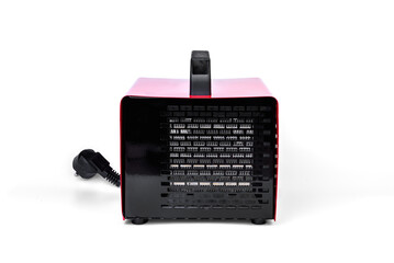 Red ceramic fan heater isolated on white background.