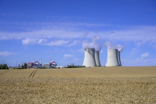 Grain field and cooling towers of the nuclear power plant, Temel&iacute;n, Jihočesk&yacute; kraj, Czech Republic