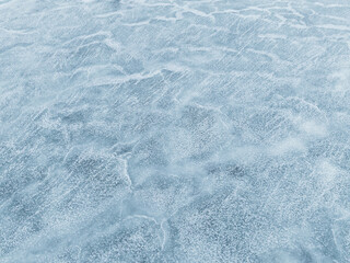 Obraz premium High angle aerial drone view of a frozen sea surface with unique natural ice textures and patterns in winter season.