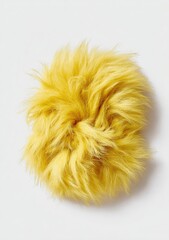 Fluffy, yellow, abstract, tufted fur shape against a stark white backdrop