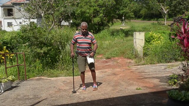 A Stroke Survivor Walking Up A Driveway