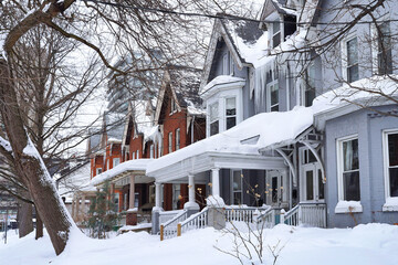 Naklejka premium Row of Victorian houses with gables in winter