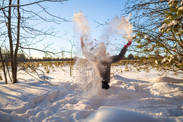 Happy Little Girl Playing with Snow in Winter