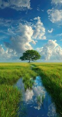 A lone tree stands in a field of green, its reflection mirrored in a stream under a blue sky