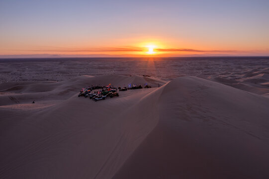 Sunset Over Desert Sand Dunes with Vehicles at Algodones
