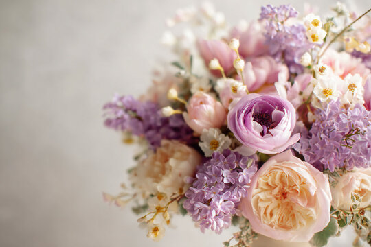 Pastel spring product hero shot with soft sage green, blush pink, lavender and golden accents, commercial photography