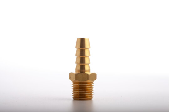 Studio shot of a brass pneumatic hose barb adapter featuring a male threaded base and a barbed tail connector, isolated on a light gray-white background. High-quality technical component image ideal f