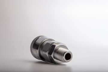 Industrial steel quick-connect air plug with female threaded hex head, professional metallic nipple connector for pneumatic systems and pressure tool attachment isolated on white background