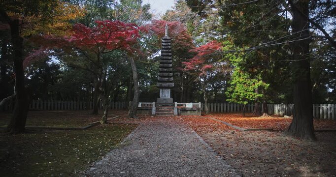 Gravel path leading to ancient Japanese stone 