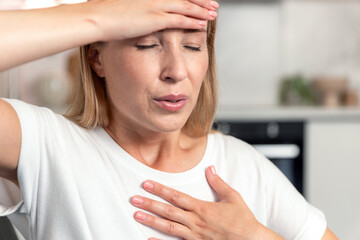 Woman experiences chest pain and difficulty breathing at home during stress
