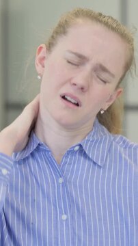 Portrait of Tired Young Woman with Neck Pain, vertical video