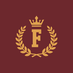 Golden letter F with crown and laurel wreath emblem.